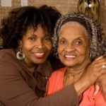 woman with arms around senior woman